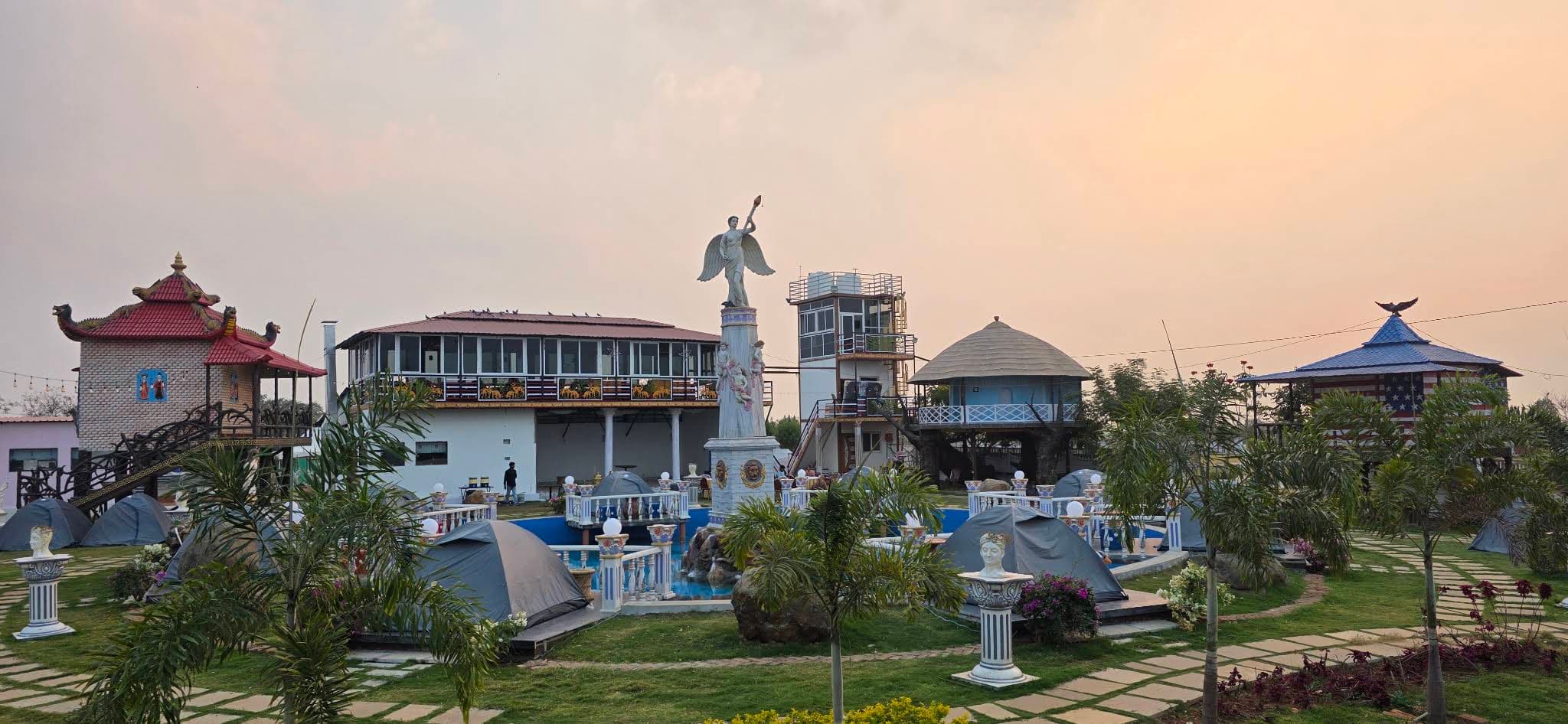 Resort cottages, swimming pool and landscaped grounds in Vikarabad
